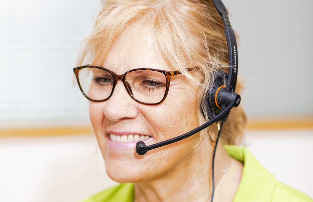 A lady taking calls using a headset